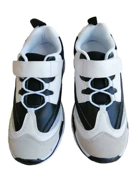 

A black and white style wearable non-slip travel shoe for Tyrannis boys and girls