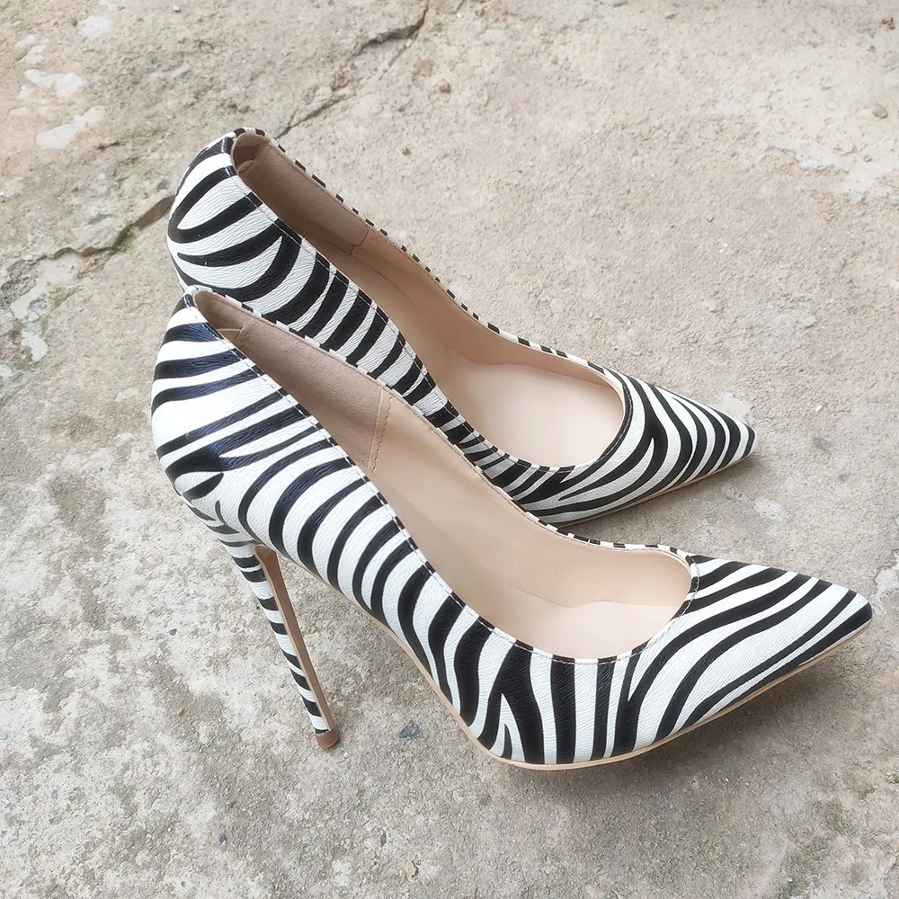 Zebra pattern high heel shoes studio cutout Stock Photo - Alamy