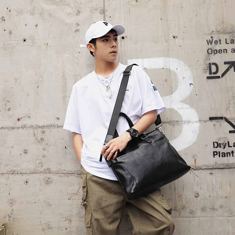 

Computer one shoulder oblique body document Korean version of business leather handbag man trend versatile new casual simple