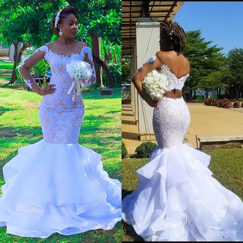 Plus Size Afrikaanse Mermaid Trouwjurken 2020 Moderne Cascading Ruches Tiered Rok Lace Lange Mouw Aso Ebi Bruid Trouwjurk Plus Size Afrikaanse Mermaid Trouwjurken 2020 Moderne Cascading Ruches Tiered Rok Lace Lange Mouw Aso Ebi Bruid Trouwjurk
