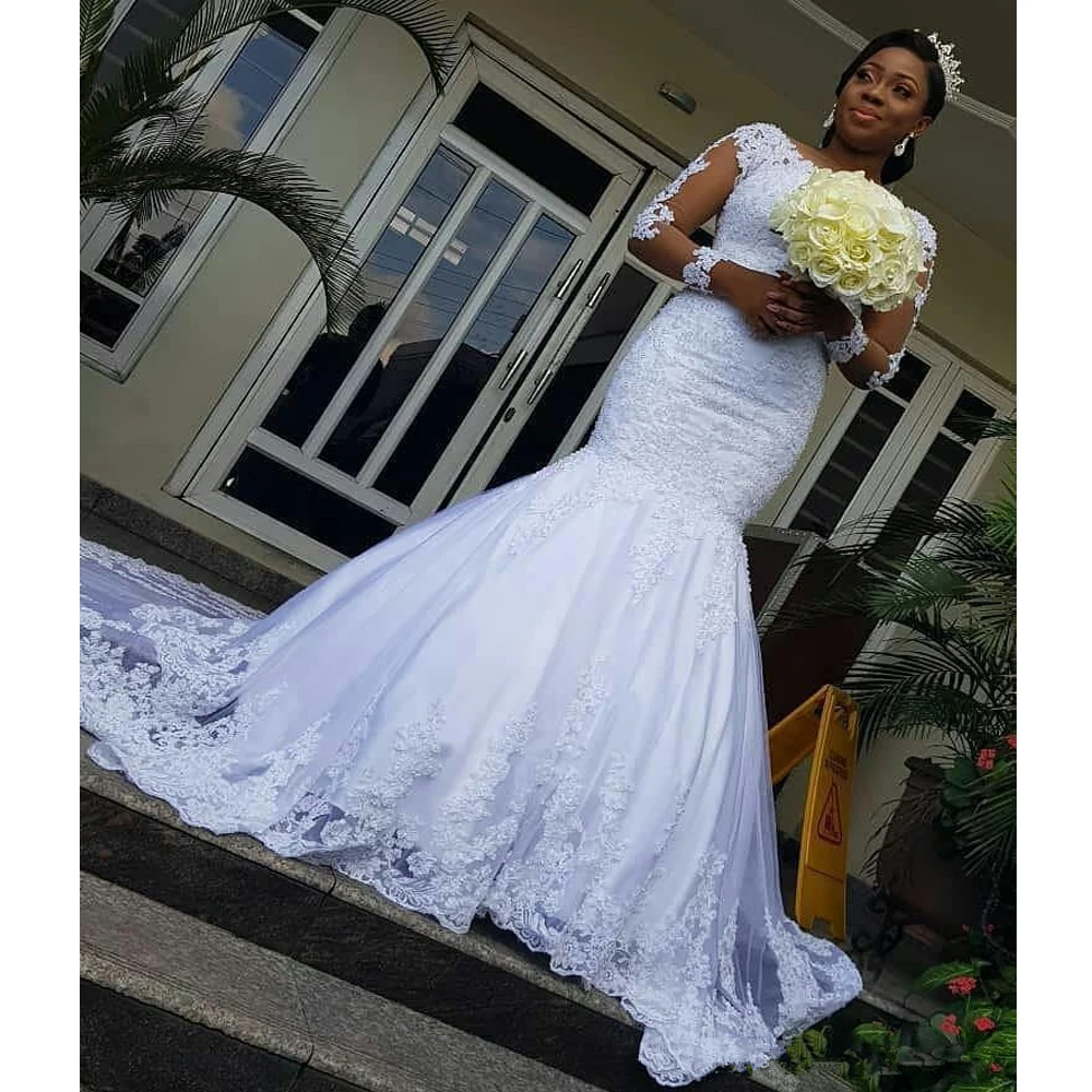 

2024 Illusion Long Sleeves African Wedding Dresses Mermaid Lace Applique Trumpet Wedding Gowns Sweep Train Bridal Dresses