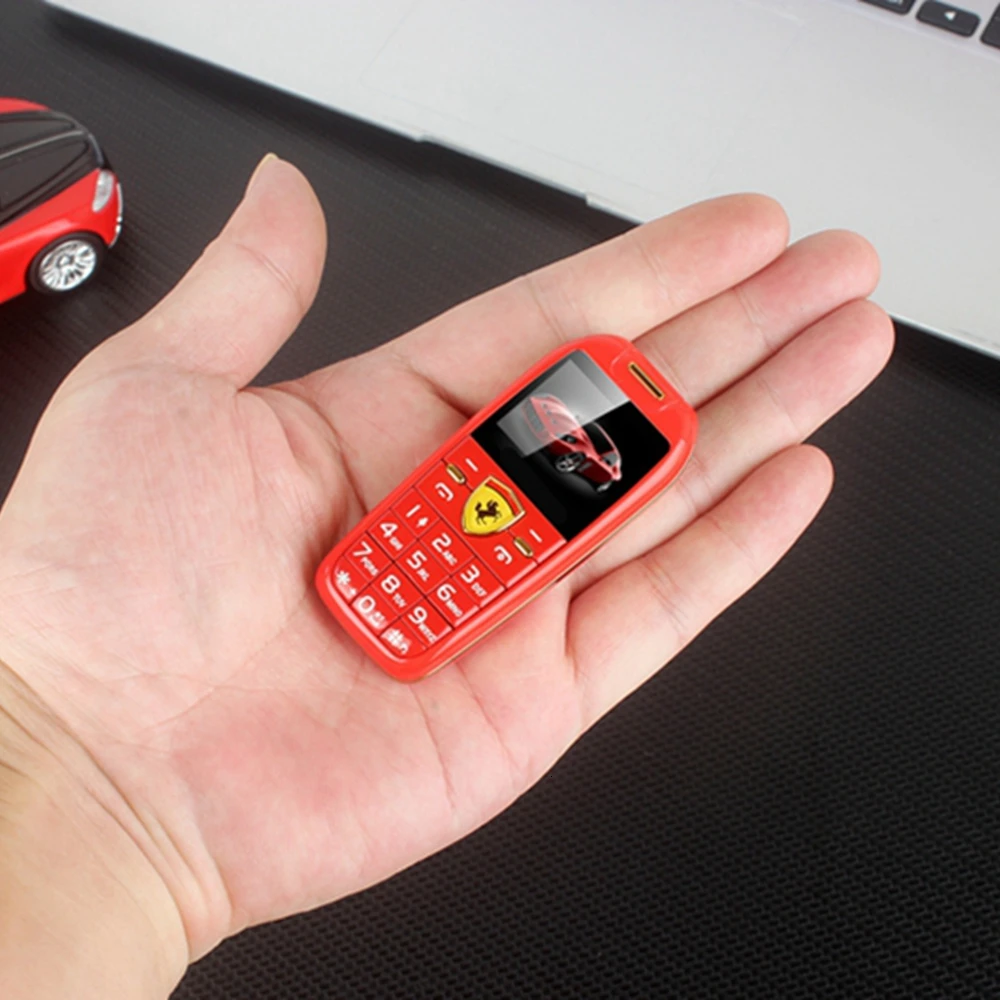 Мини-Автомобильный кнопочный мобильный телефон 1,", ручной телефон, волшебный голос, MP3, Bluetooth, набор номера, маленький размер, дешевый детский мобильный телефон