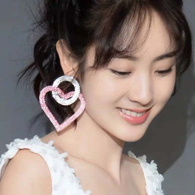 Европейские и американские преувеличенные розовые серьги в форме спирали Joker Is