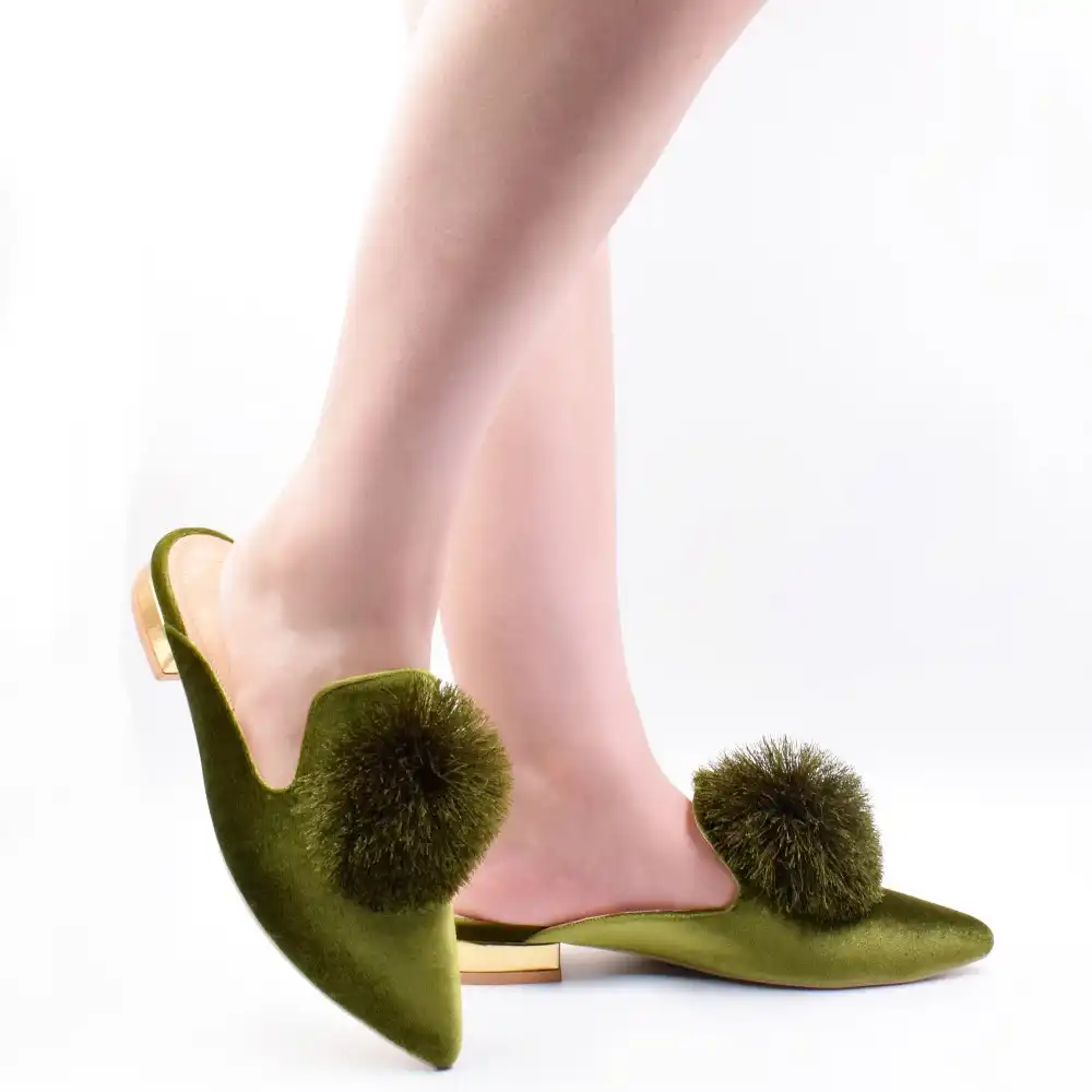 mules with pom poms