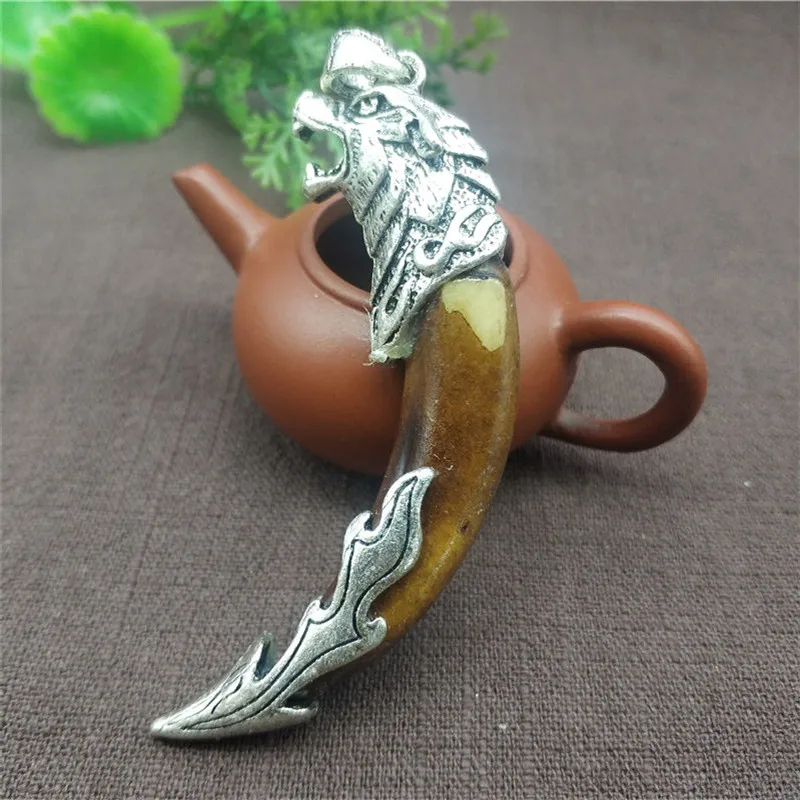Chinese-antique-dog-teeth-with-Tibetan-silver-amulet-carved-dragon-pendant