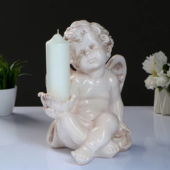 

Candlestick "Angel sitting in the hand" 26x21x30cm aged 3739340