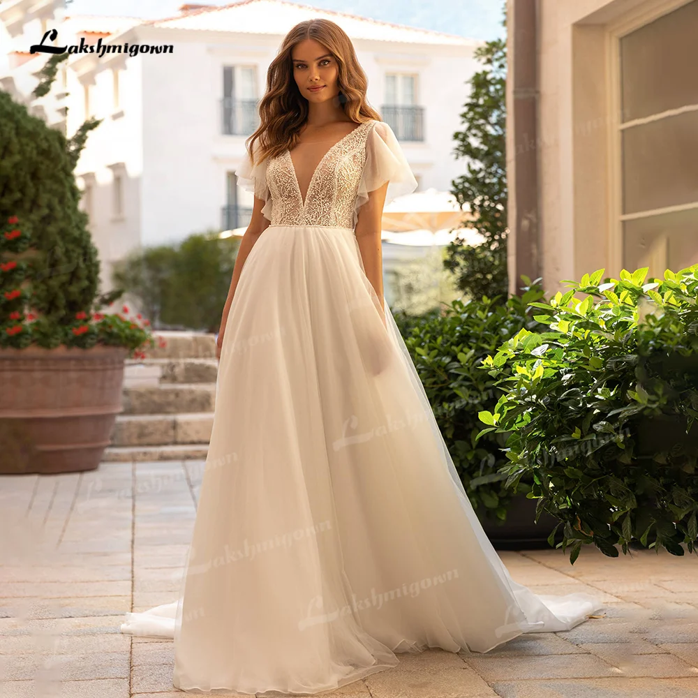 Bohemian A Line Beach Wedding Dress with Short Puff Sleeves Elegant Tulle Backless Bridal Dresses V Neck vestido de noiva simple gown for wedding