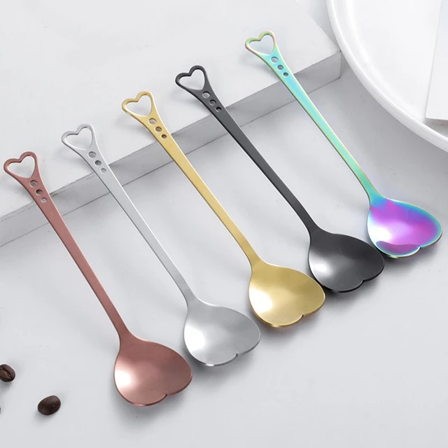 Clean shiny metal spoon isolated on white. Stainless steel small kitchen  dessert teaspoon cut close up. Tablespoon. Kitchen utensils concept. Set of  realistic spoons from different points of view Stock Photo by ©