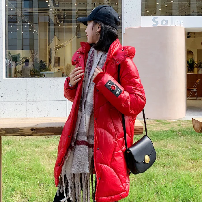 

According to Nalini White Duck Down Jacket Women's New Style Sense of Design Non-mainstream Young Red Bright Surface Loose And P