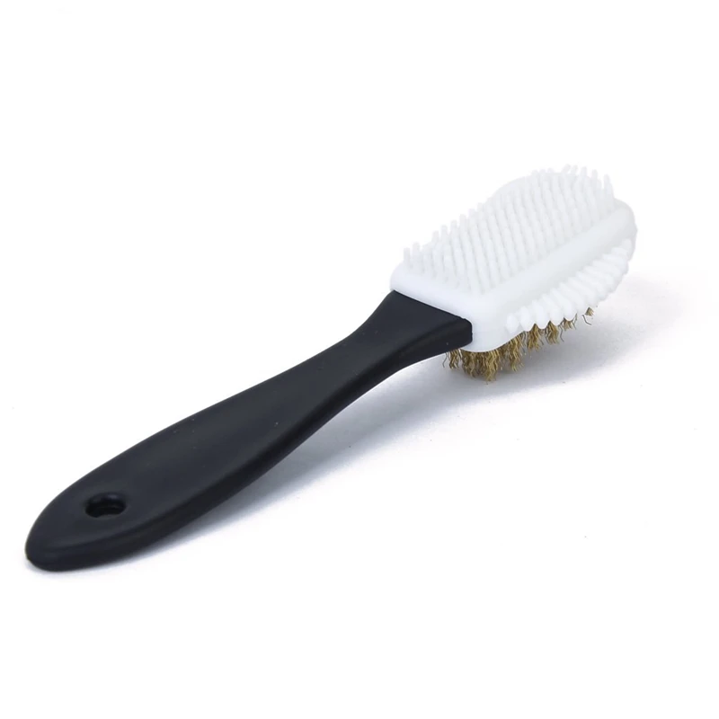 Shoe brush applicator polishing snow shoes Sweden and Nubuck boot