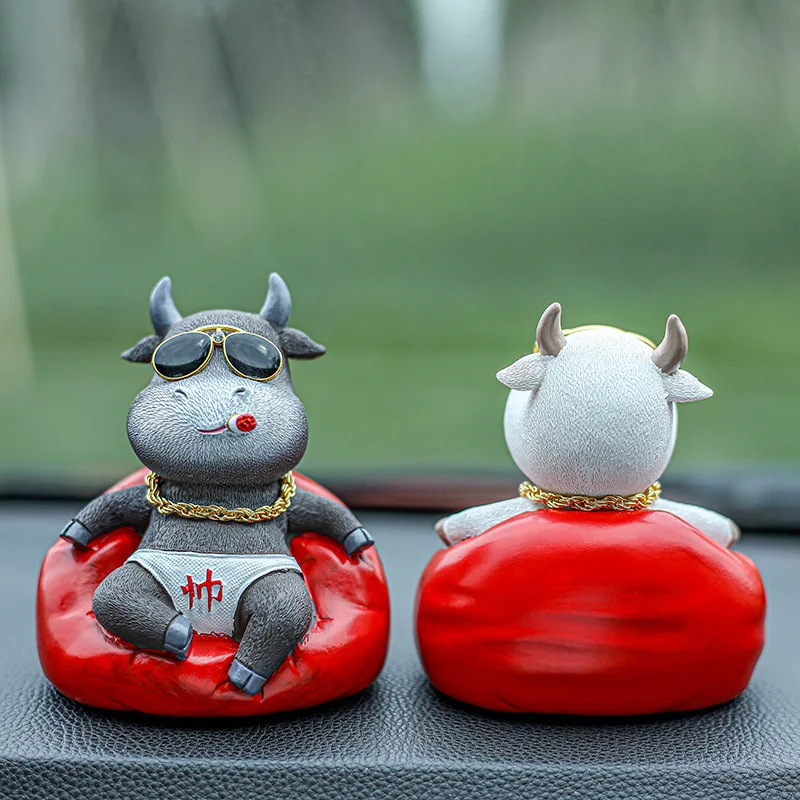 

Car ornaments cattle interesting resin ornaments in the car instrument panel decoration products cool Year of the Ox ornaments