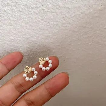 

Exquisite designer pearl camellia earrings simple hollow flower pearl earring party accessories