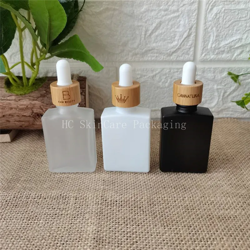 

Матовые, яркие цвета, квадратная стеклянная бутылка с бамбуковая пипетка Сыворотка стеклянная бутылка с эфирным маслом стеклянный флакон-капельница с бамбуковой крышкой
