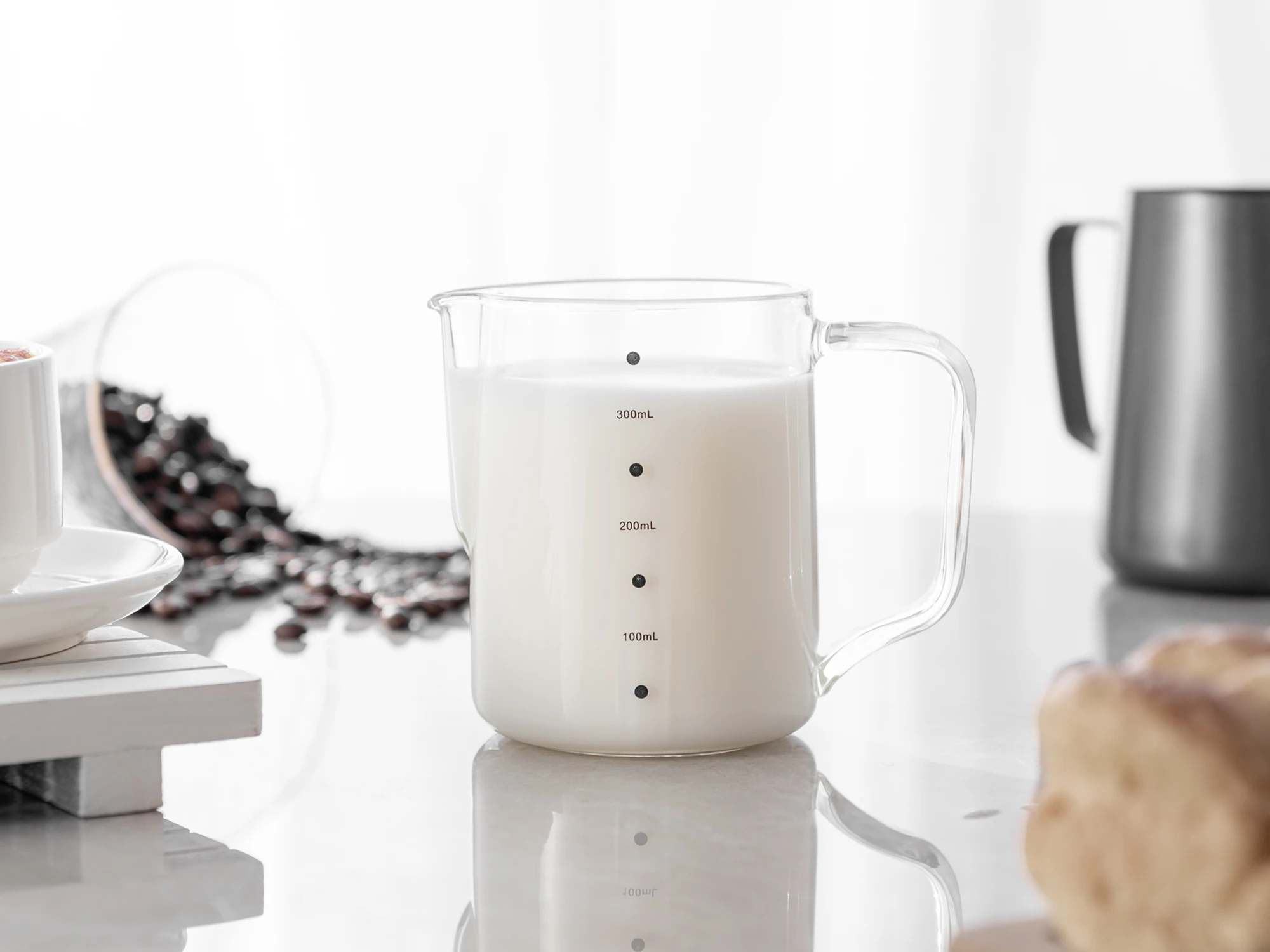 https://ae01.alicdn.com/kf/H8573c9b133c747d98ad9e7ccb22afd9d3/Glass-Milk-Frothing-Pitcher-with-Measurement-600ml-350ml-Hammer-Heat-Resistant-Glass-Milk-Coffee-Cappuccino-Latte.jpg