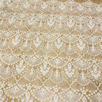 

Ivory color, sequins embroidered tulle mesh lace fabric for bride salon gowns, dresses wholesale price available