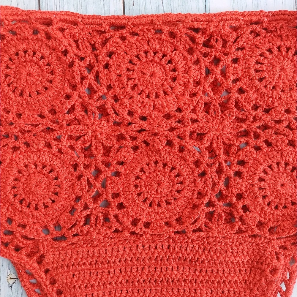 Elevate your swimwear collection with our High Waist Crochet Flower Bikini Bottoms. These stylish thong-style swimsuit shorts feature a delicate hollow-out design, perfect for adding a touch of elegance to your beachwear wardrobe.