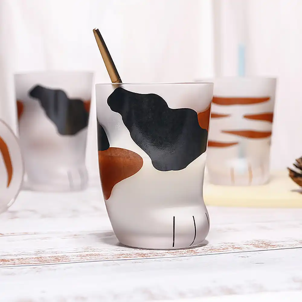 cat paw drinking glass