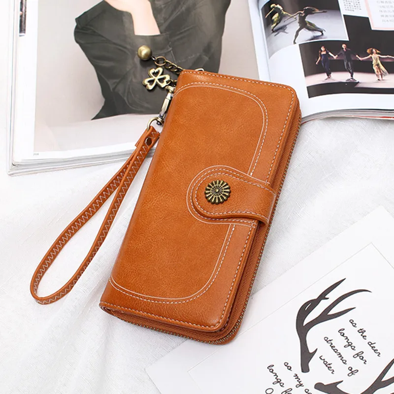 

New 30% zipper wallet long waxed leather hand bag explosions multi-card oil phone bag