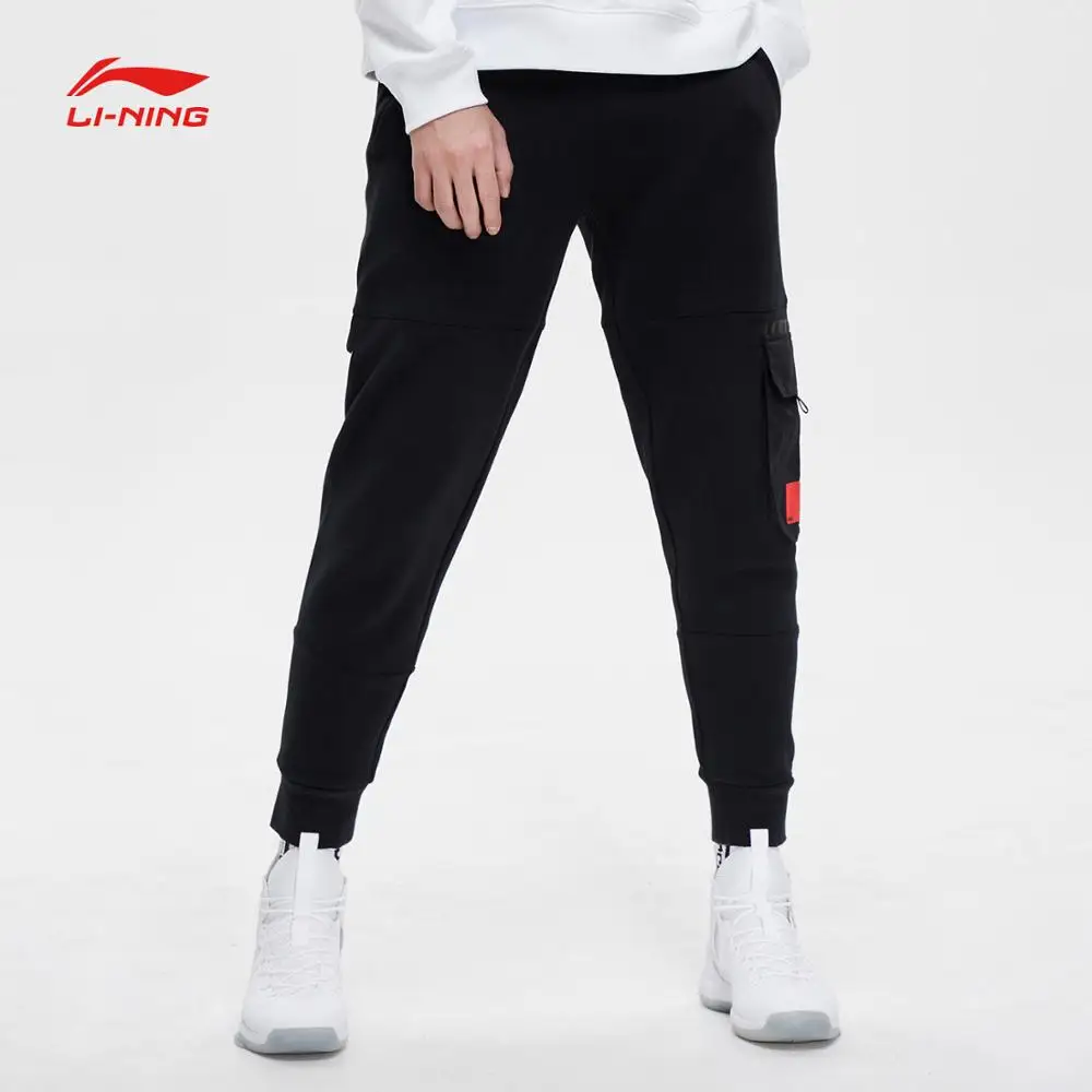 Клиренс) Li-Ning мужские трендовые спортивные штаны, комфортные, обычные, подходят, 66% хлопок, 34% полиэстер, подкладка, спортивные штаны AKLP015 MKY468