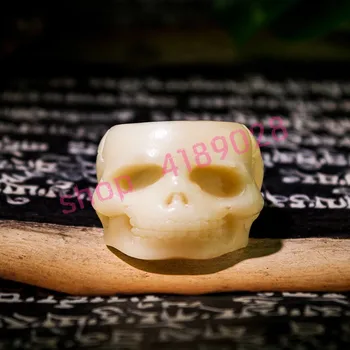 

Natural camel bone, hand carving skeleton head ring, bone carving handicraft ornaments.