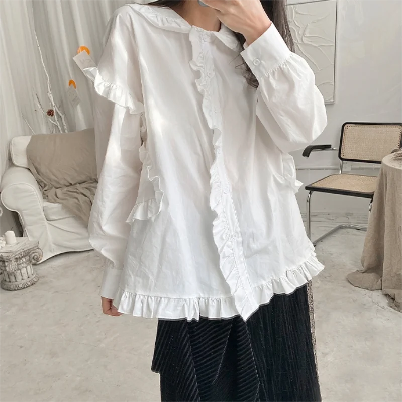 The new spring and autumn ladies loose flounces lapel long sleeve pure color blouse deconstruction art French blouse