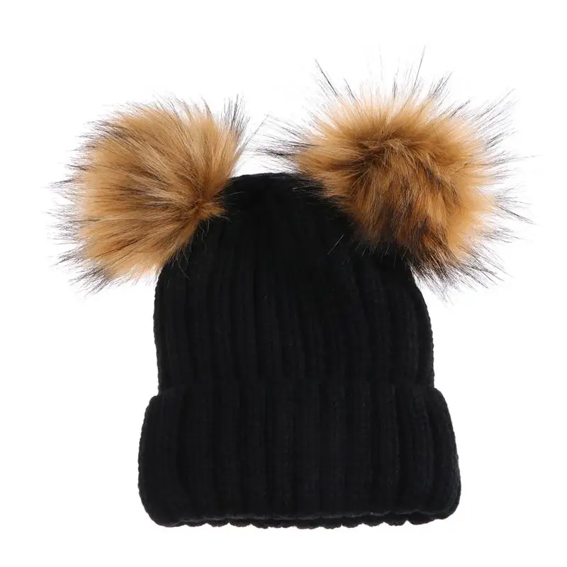 black hat with brown pom pom