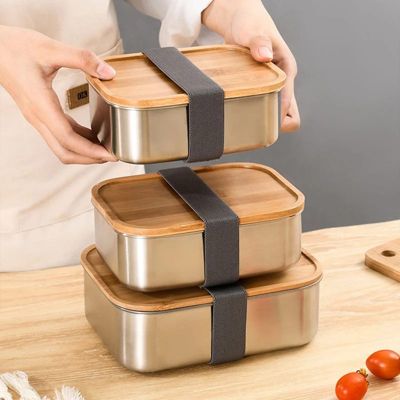 Stylish stainless steel bento box with wooden cover: perfect for lunches on the go