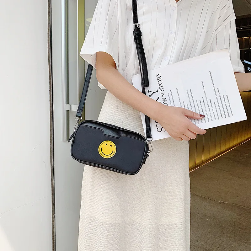 

Oxford cloth smiling face casual slung cloth 2019 new Korean version of Joker net red shoulder small square bag