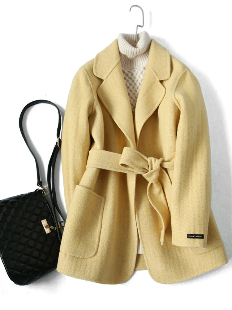 

Korean version of the winter short coat coat, hand-skinned slim double-faced women coat, Waist lace-up women coat winter .