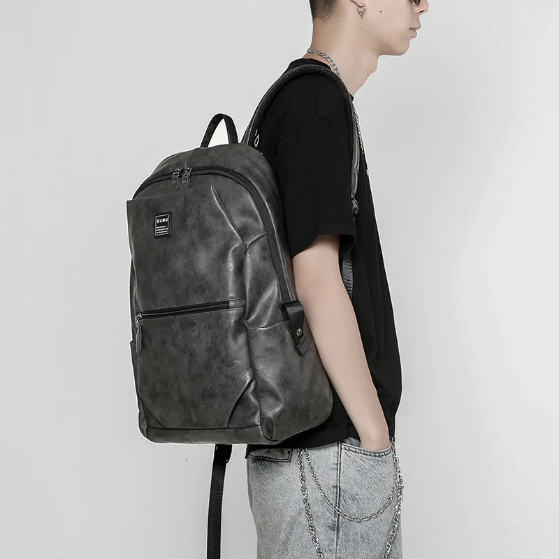 

Fashion backpack men's leisure travel bag simple leather schoolbag for college students