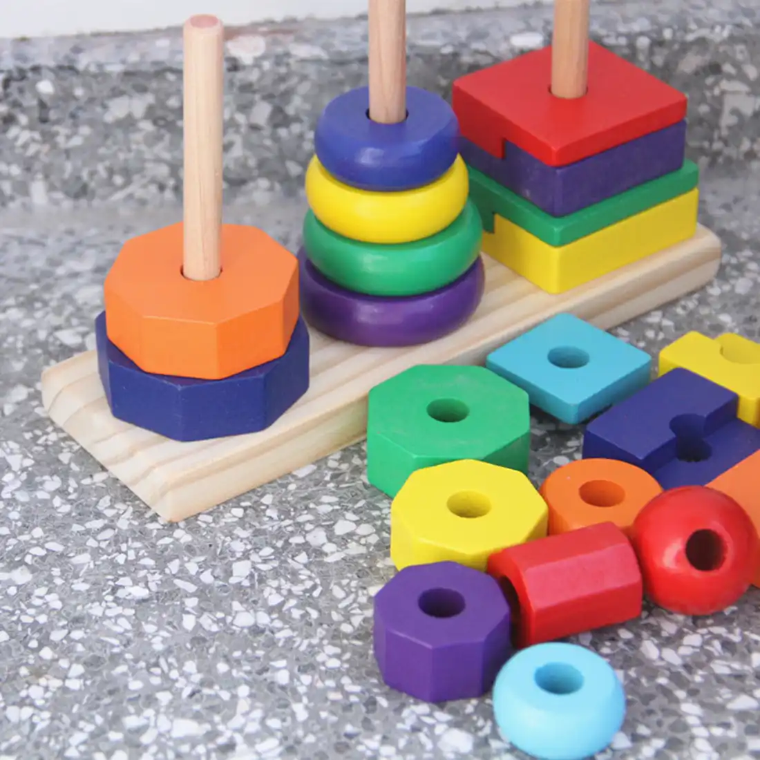 3 columns wooden geometrical blocks stacking tower