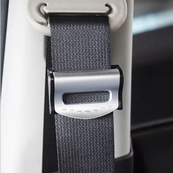 

A pair of seat-belt-clamps for loading the vehicle seat belt buckle seat belt retainers to adjust the retainers