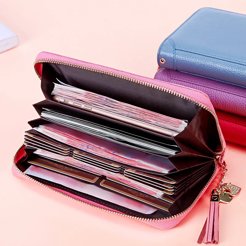 

The first layer of cowhide women's hand-held wallet large capacity zipper bills folder ladies hand bag tassel