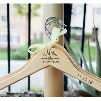 

Personalized wooden wedding hangers - add your name and date. Suitable for bridesmaid gifts - custom hangers for bride and bride