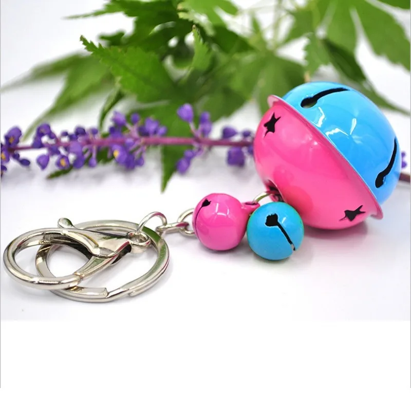 

Cute fashion bell key foddle two-color metal paint bell pendant ladies bag car pendant.