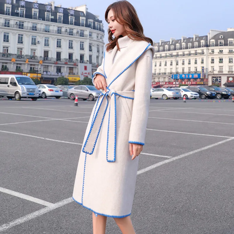 Woolen coat female long section autumn and winter hooded band width pine new foreign gas Korean version of the knee