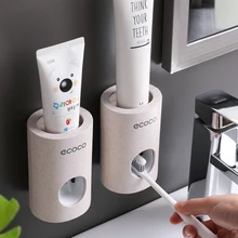 Ecoco automático dispensador de pasta de dentes à prova de poeira suporte de escova de dentes trigo palha fixado na parede creme dental squeezer para banheiro