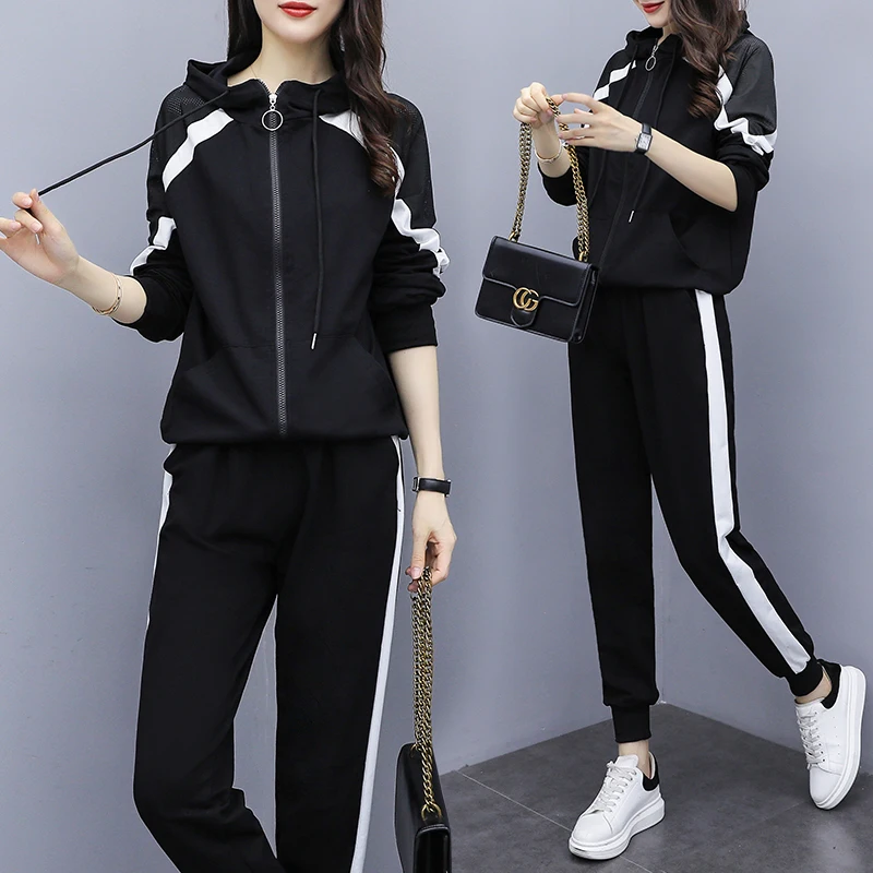 black tracksuit with white stripe