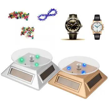 

Portable LED Light Solar Powered Rotating Turntable Display Stand for Jewelry Phone Watches Camera Packaging Jewelry Display i