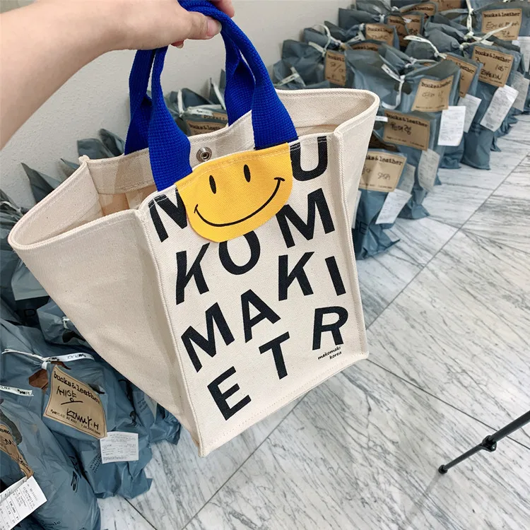 2022 Canvas bag New Summer Korean Japanese Cartoon Canvas Smile Handbag Large Capacity Shoulder Bag Hit Color Letter Female Tote