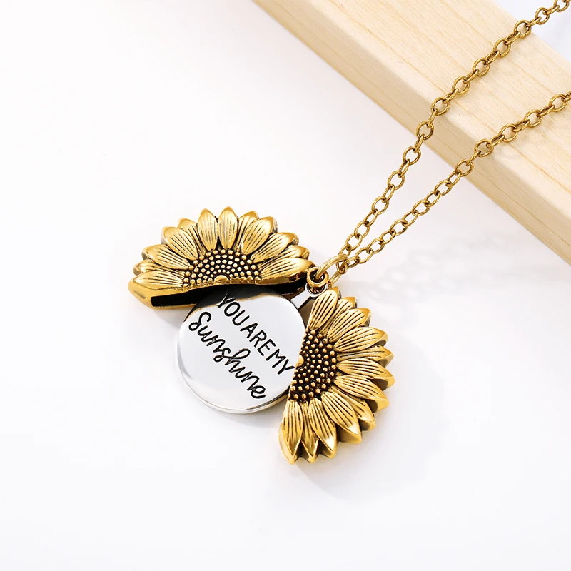 A You Are My Sunshine Necklace with a sunflower pendant.