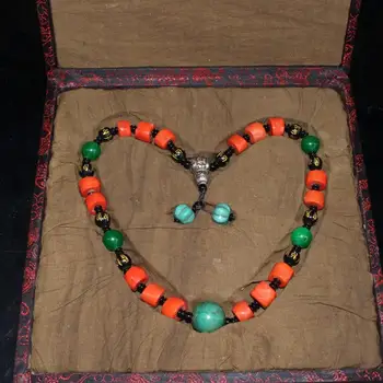 

Exquisite dyed coral necklace with beads in hand