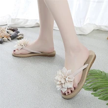 Tongs d'été décontractées à fleurs pour femmes, chaussures plates à enfiler, sandales de plage antidérapantes à la mode, nouvelle collection