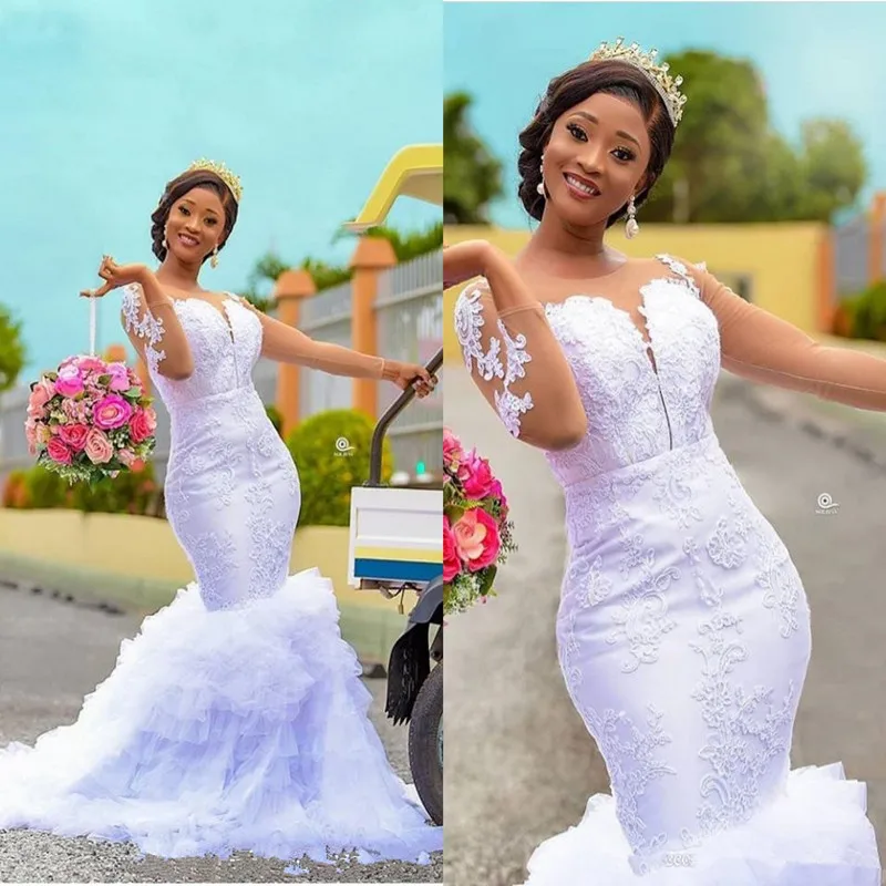 Lange Mouwen Mermaid Trouwjurken 2020 Sheer Jewel Hals Lace Applique Tiered Rok Afrikaanse Nigeriaanse Tuin Trouwjurk Lange Mouwen Mermaid Trouwjurken 2020 Sheer Jewel Hals Lace Applique Tiered Rok Afrikaanse Nigeriaanse Tuin Trouwjurk