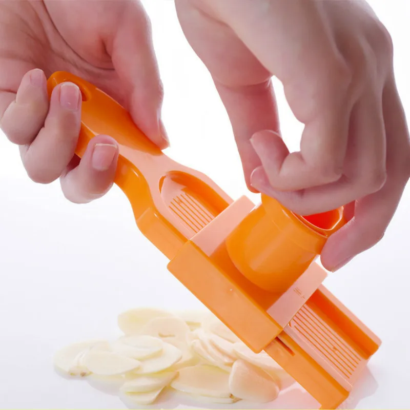 

Japan Candy Color Kitchen Accessories Plastic Garlic Slice Grinding Tool Magic Silicone Peeler Slicer Cutting Machine