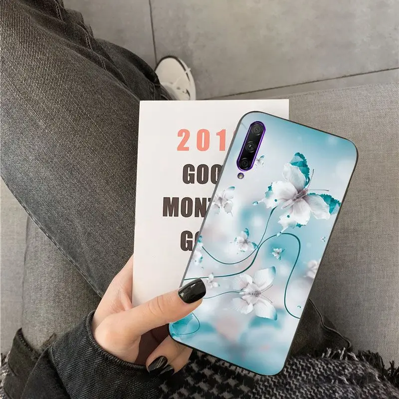 Red butterfly on white roses flower