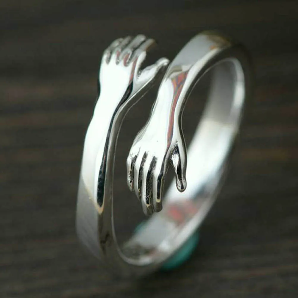 Ofertas Especiales 2021 las nuevas mujeres las niñas mano Rizeable anillo creativo amor abrazo de Color plata anillo de señora de la moda joya de anillo abierto regalos para los amantes GR6Je30QM5z