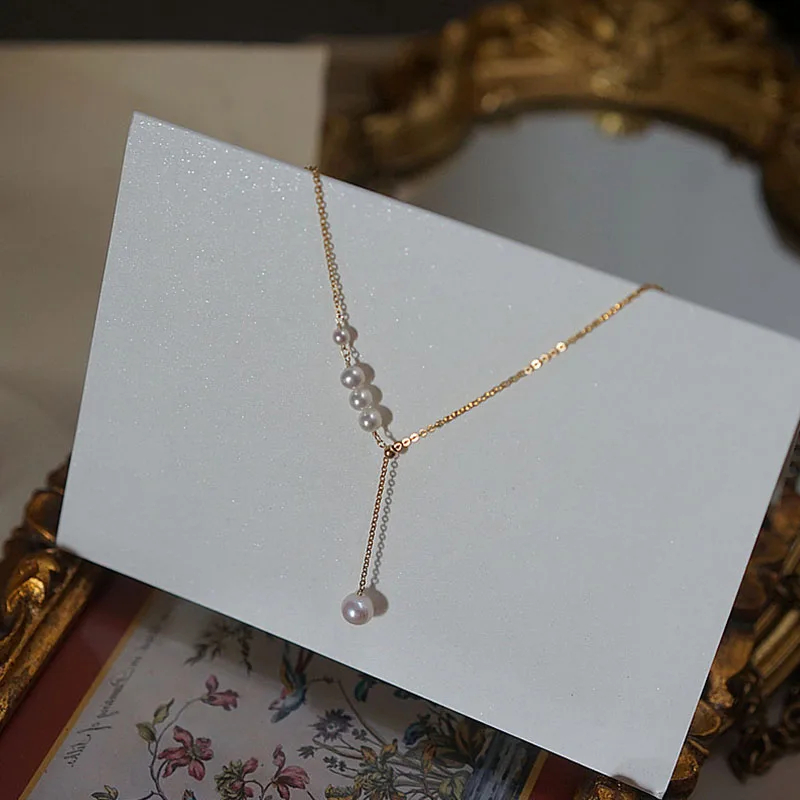 Collana lunga con nappa con conchiglia di fiori di ciliegio per