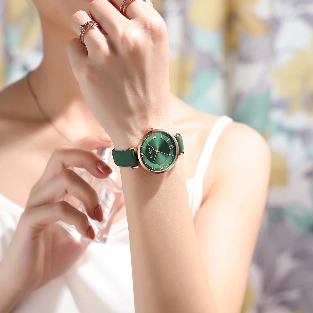 A woman wearing a Classic Clock Leather Wristwatches Multiple Colors from the collection of multiple colors.