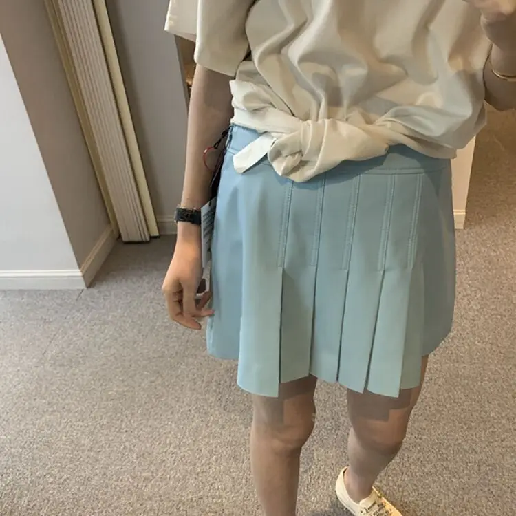 19SS Paper Sheet People Effect with a Cargo Light Blue Pleated Small Leather Skirt